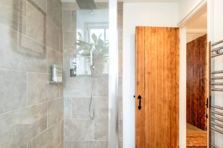 Walk-in shower at the Glastonbury cottage — a private bathroom during Glastonbury Festival week