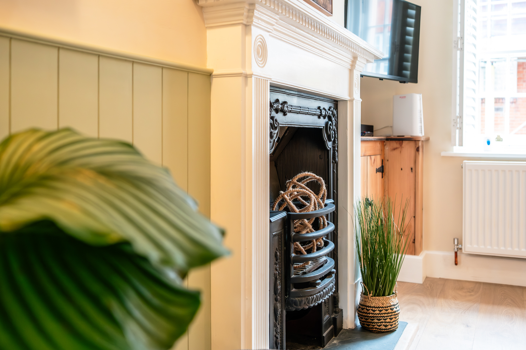 Close-up of the original cast iron fireplace at No. 48 Magdalene Street