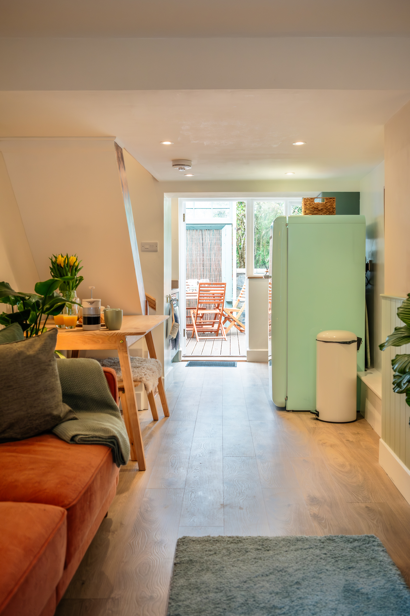 View through the cottage from the sitting room to the kitchen and outdoor deck at No. 48 Magdalene Street