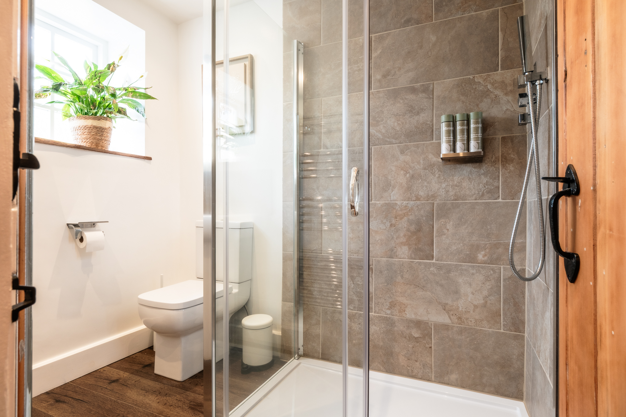 Bathroom at No. 48 Magdalene Street with glass shower screen and tiled walls