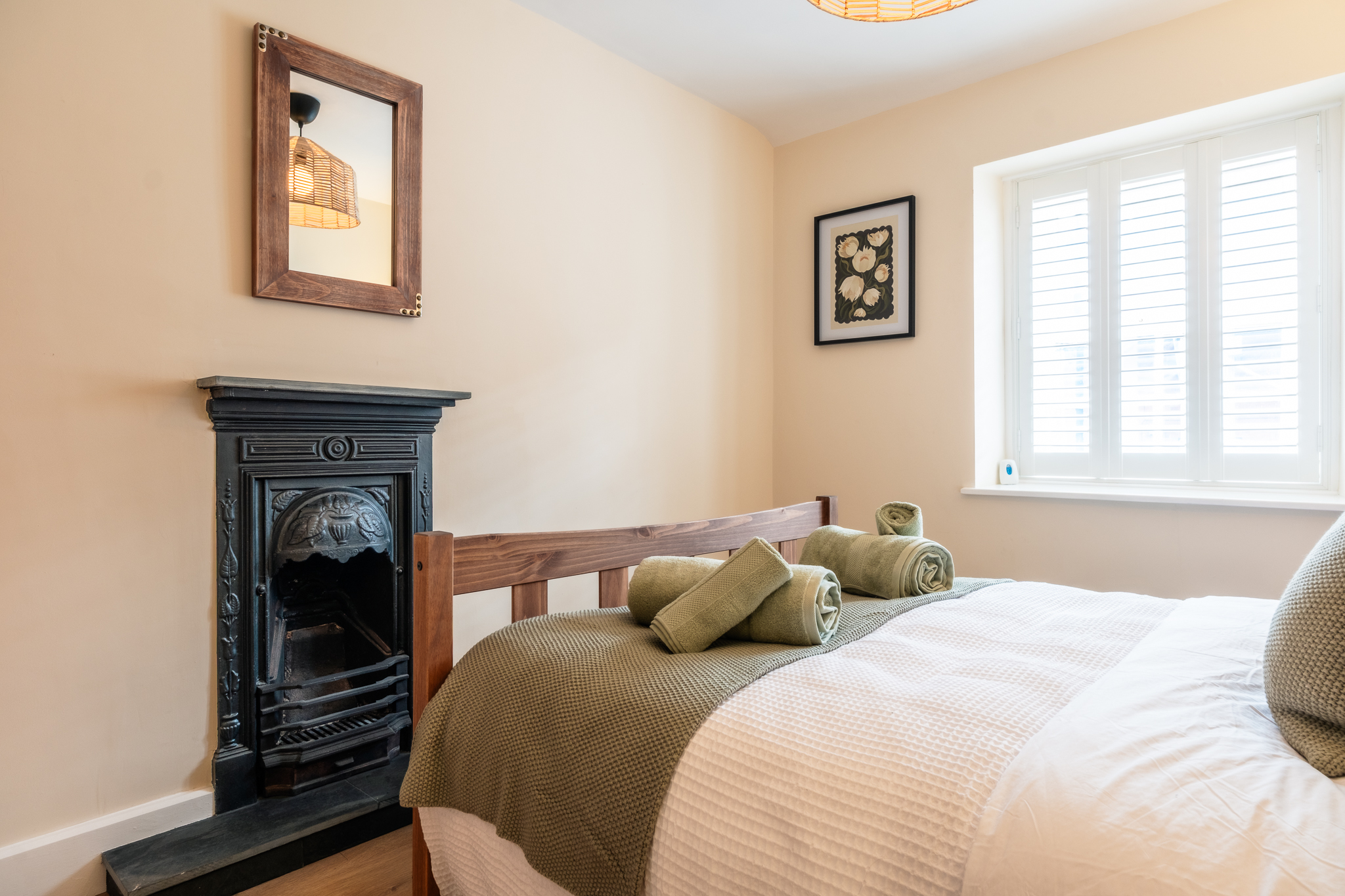 Original fireplace and mirror in the bedroom at No. 48 Magdalene Street